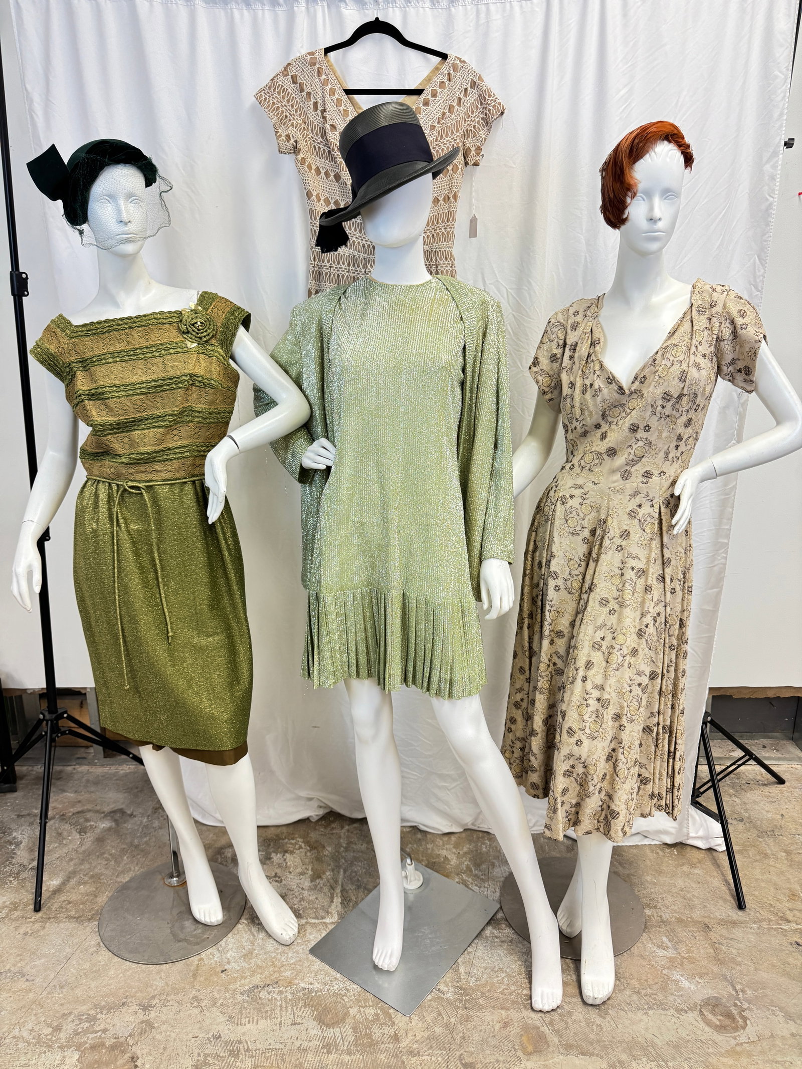 4 Fancy Ladies 1960's Dresses: A group of 4 vintage fancy ladies dresses c1950/60's to include a Carlyle fitted sleeveless green knit metallic dress with a knit lace bodice, a metallic drop waist dress with pleated skirting and mat