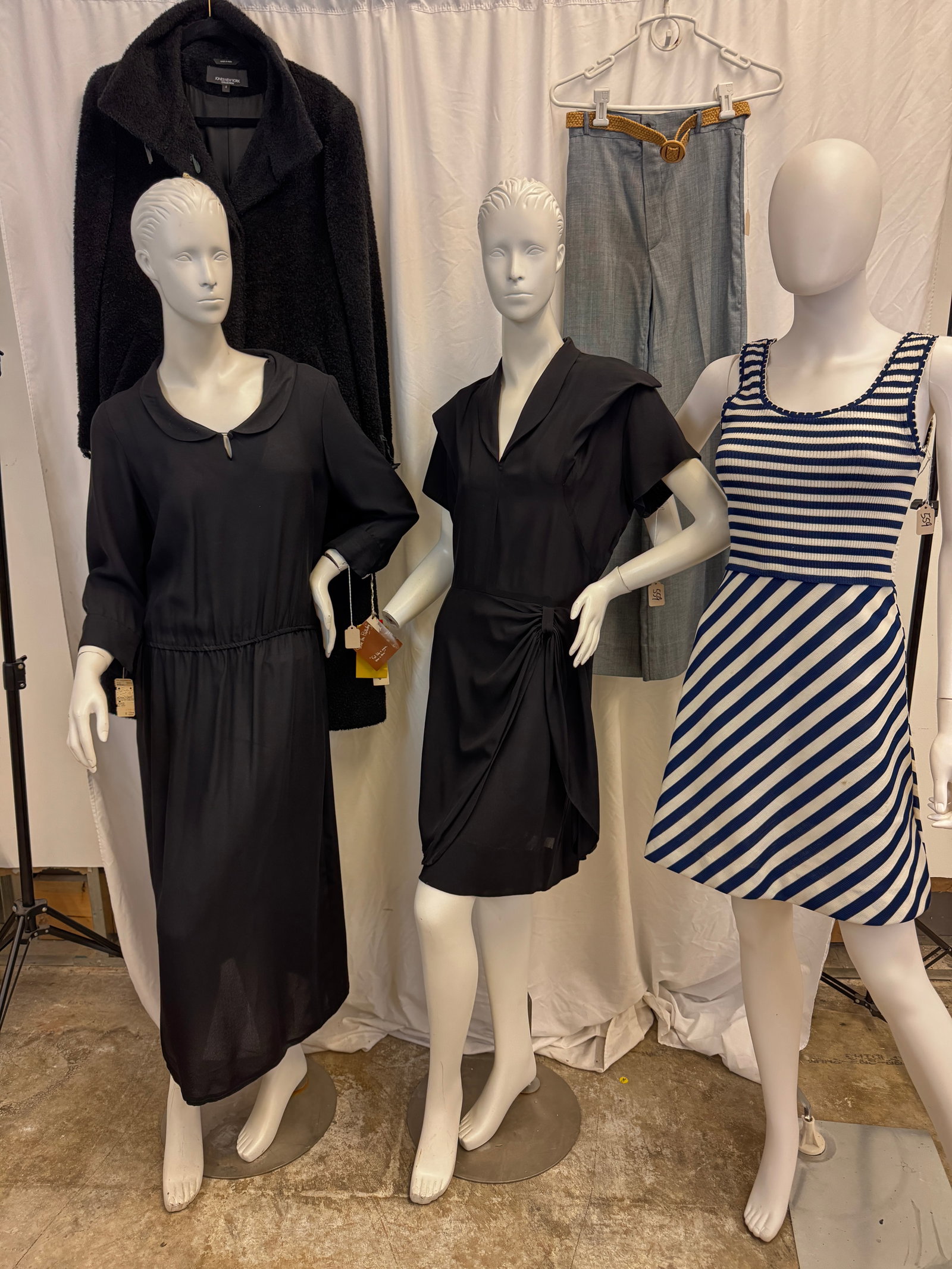 Mixed Vintage Group of Ladies Garments, Diane Von Furstenburg Deadstock, More!: A group of vintage ladies garments to include a 1970's striped poly knit stripped sundress by Giamo, a pair of ladies high waisted bell bottoms, a 1940's fitted black rayon dress, a 1970's Diane Von F