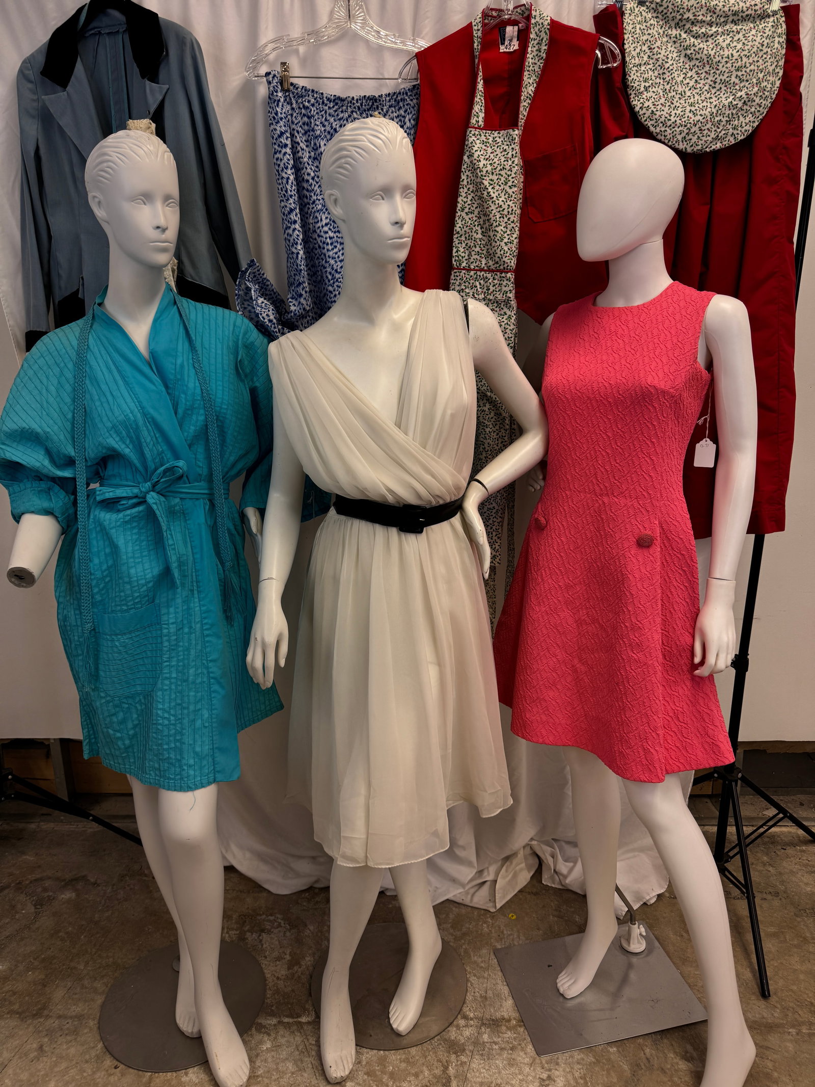 Mixed Vintage Group of Ladies 1950-70's Garments: A vintage group of ladies garments c1950-70's to include a 50's white chiffon Jack Brown fit and flair V neck dress, a red skirted Mrs. Claus style outfit with top, apron and cap, poly pink textured s