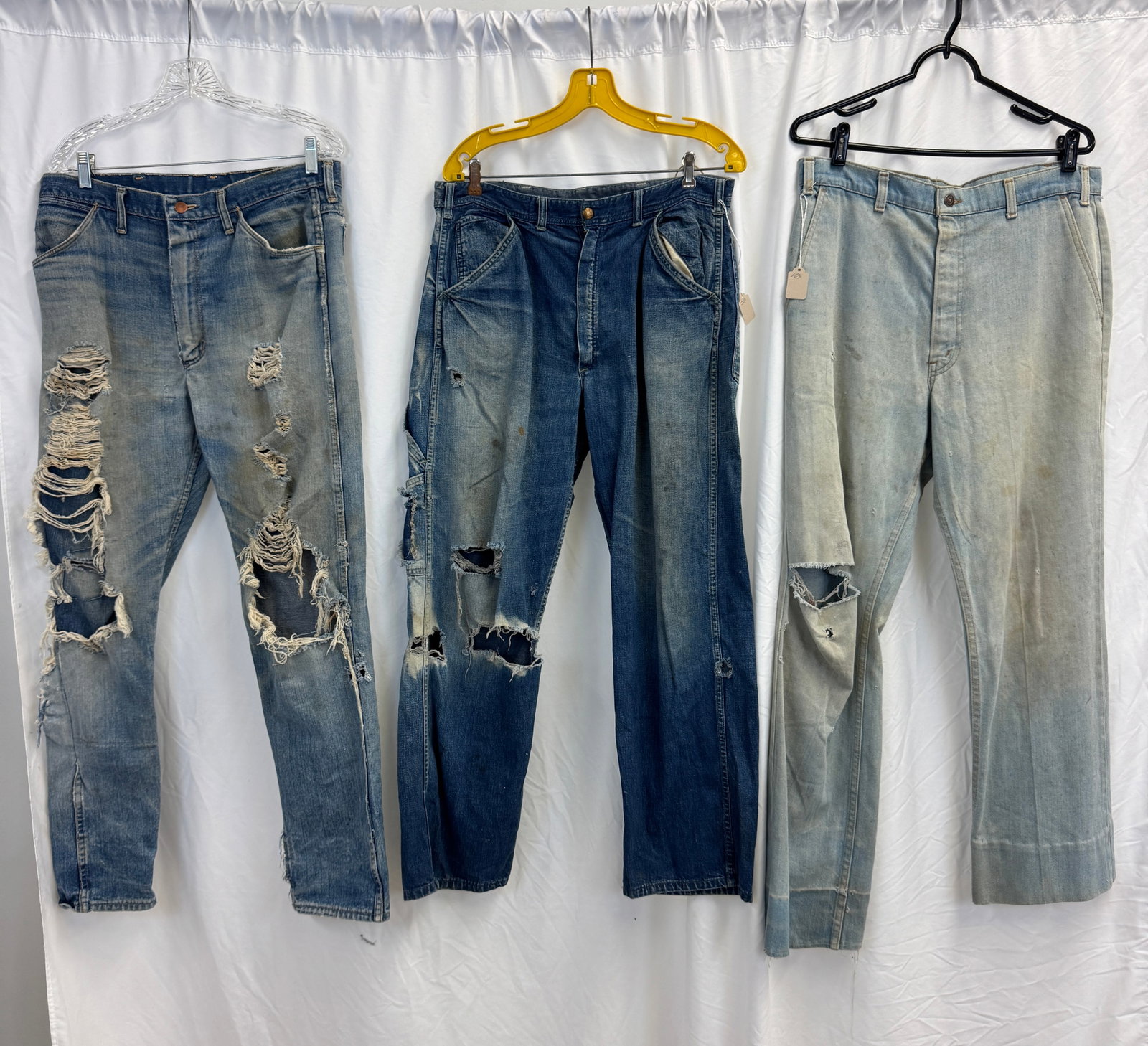 Vintage Denim Jeans c1950/70's, Carters, Wrangler: A group of vintage denim jeans to include a pair of 34" waist Wrangler jeans c1960's, a Pair of Lee 1970's jeans, and a pair of late 1940's Carters Jeans , all in as found condition.