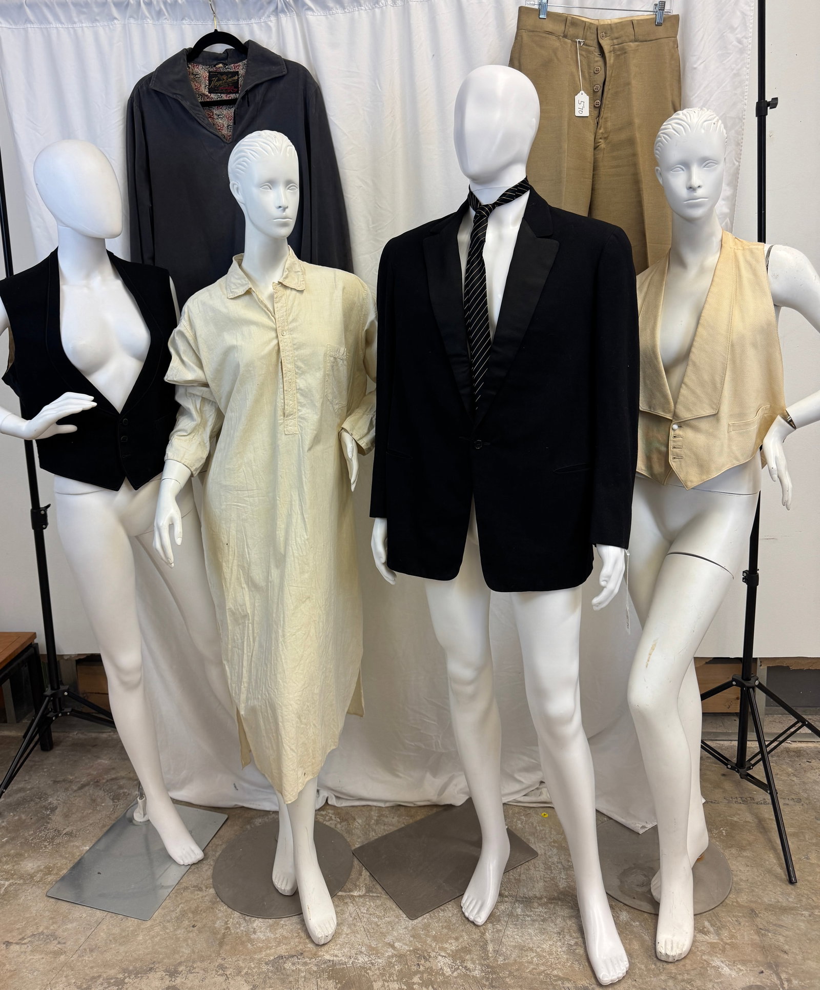 Antique Group of Men's Clothing: A group of antique and vintage men's clothing to include a 1909 black wool tux jacket sz 40 (deterioration of lining in armpits), a Victorian white cotton pique gentlemen's vest, a black wool turn of 