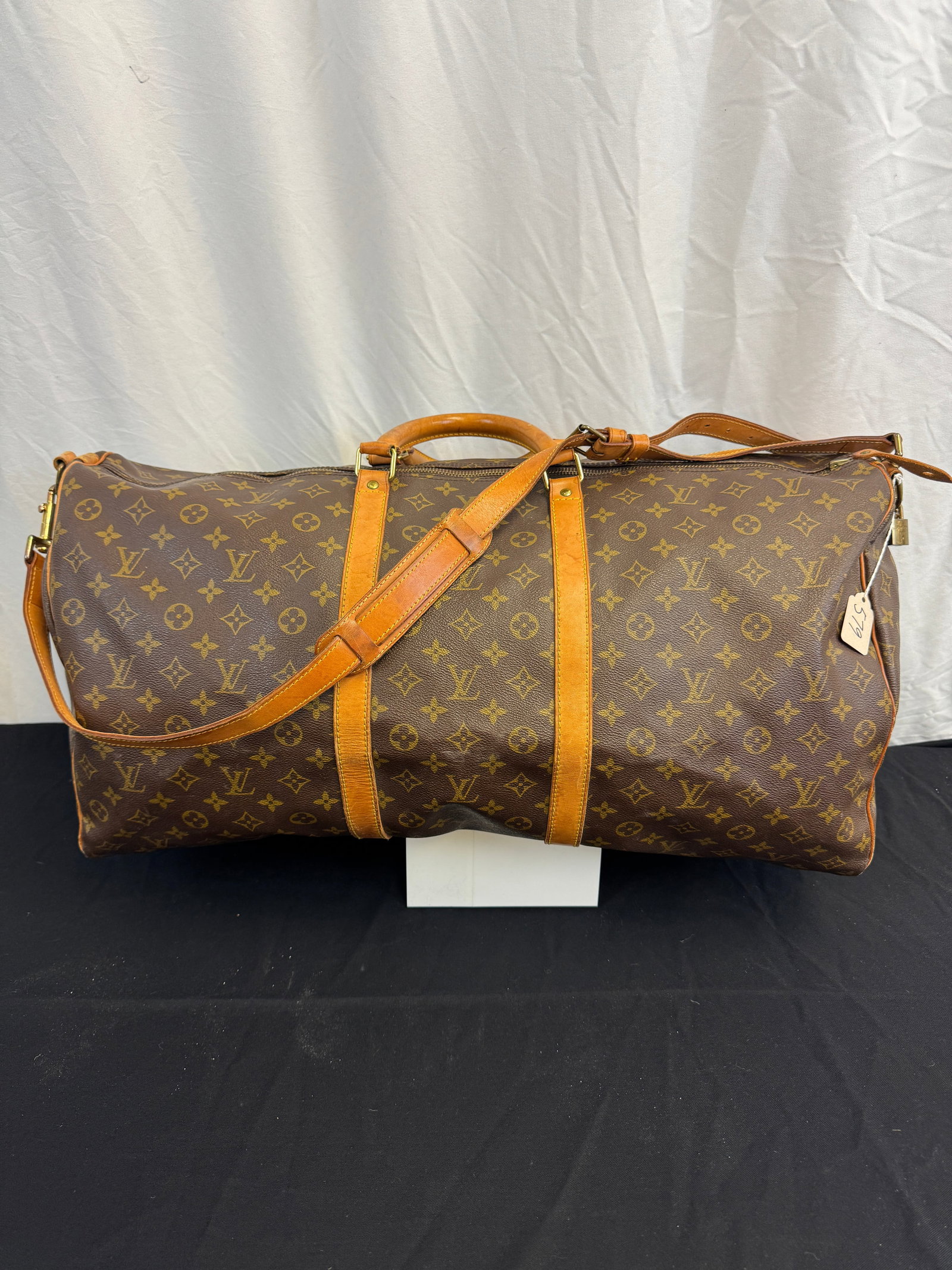 Louis Vuitton Vintage Monogram Keepall Duffle Bag C1994: A Louis Vuitton Monogram Keepall duffle bag in very good condition. Light wear to leather and on edges, key for monogram padlock. It measures 12" tall X 25" across X 11: deep.