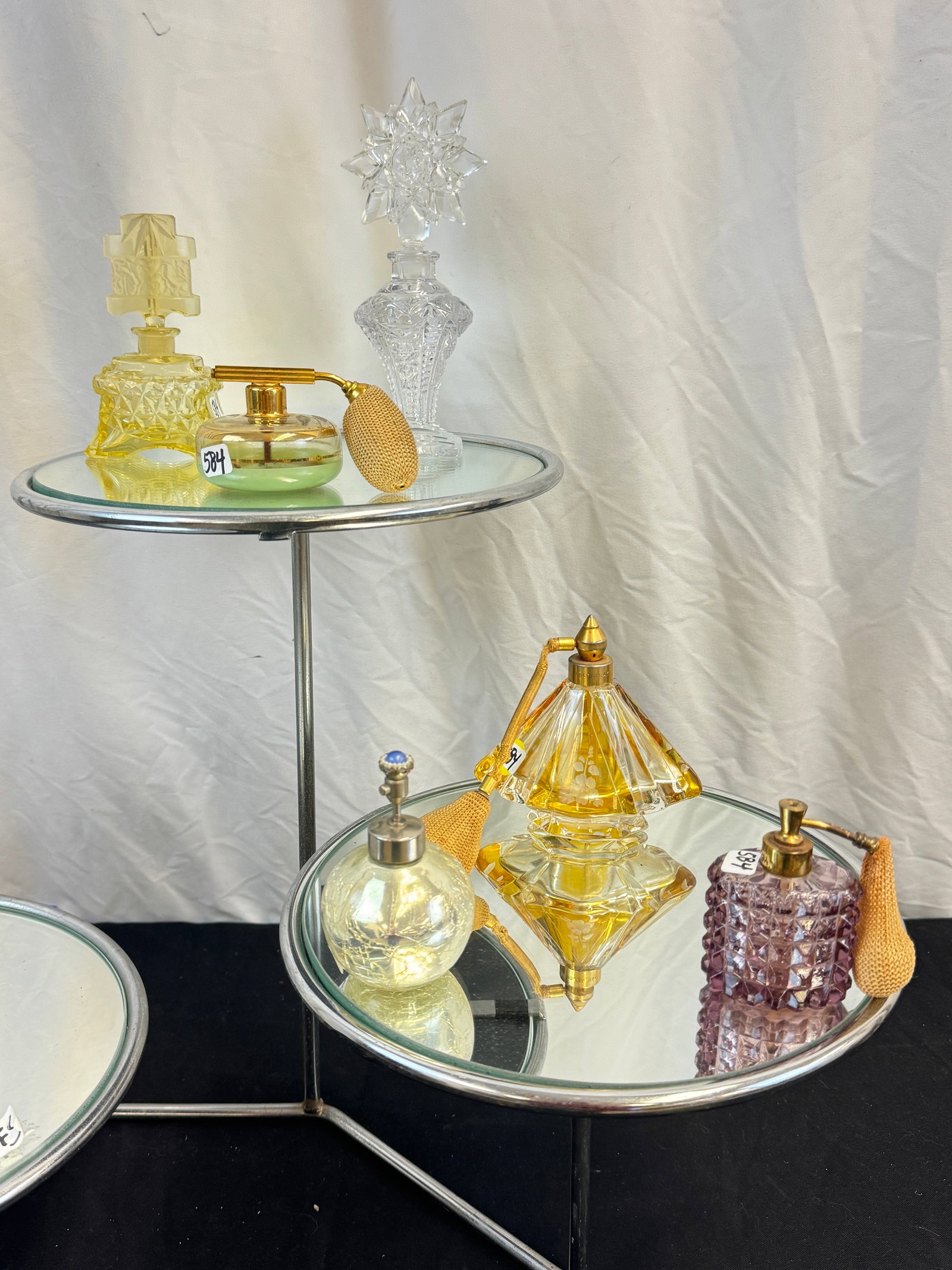 Group of Vintage Perfume bottles c1930/50's: A group of vintage crystal and glass perfume bottles to include a 20's Art Deco 5" tall Czech glass bohemian perfume bottle, and 8" tall American 19th century pressed glass bottle with starburst stopp