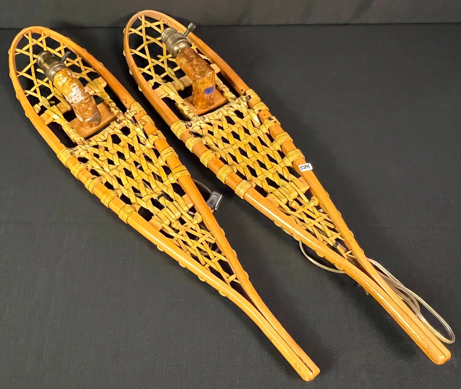 Snowshoe Wall Sconces & Framed American Indian Advertising: A pair of unusual custom made snowshoe wall sconces (30" tall X 7" across) along with an framed reproduction of a vintage "Chemung" brand cigar box label, depicting a Native American figure in a