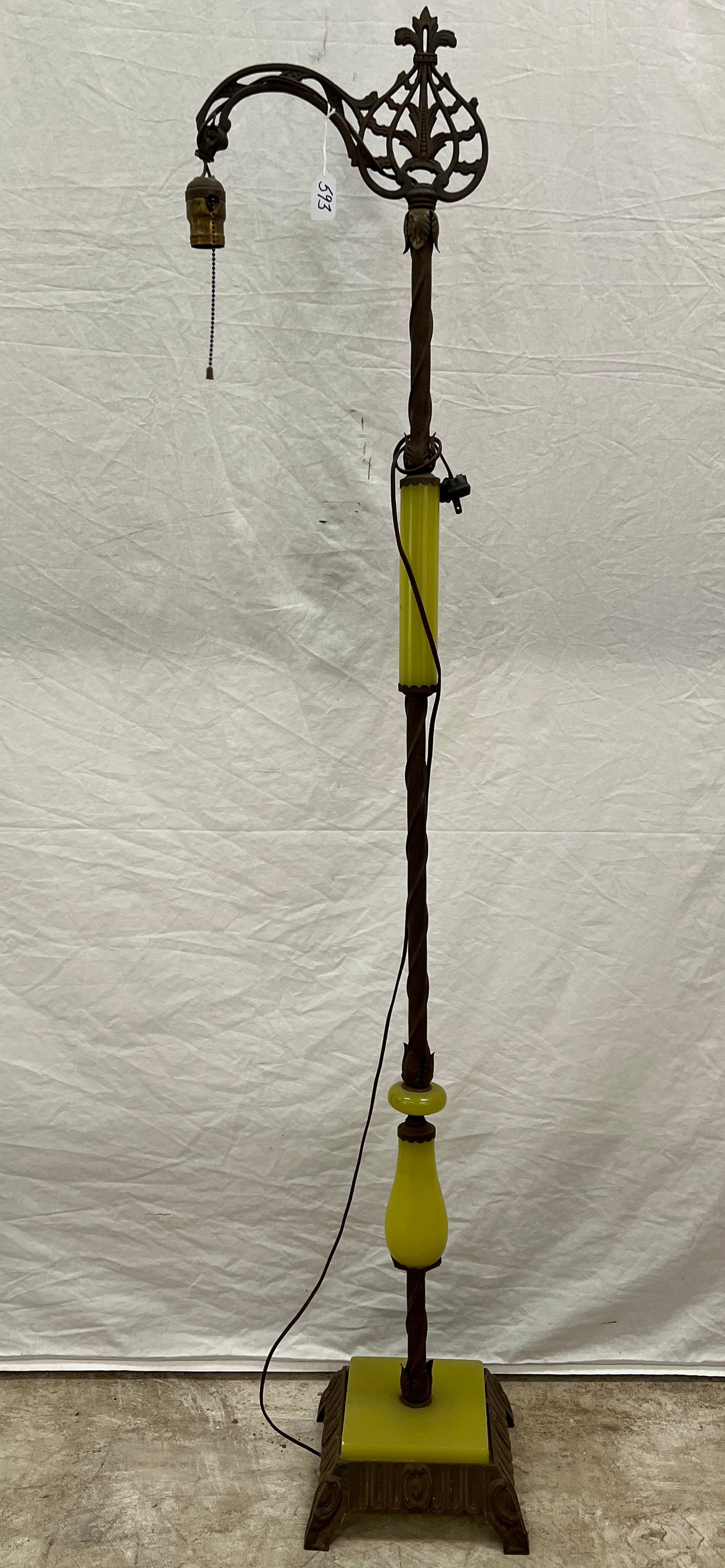 Art Deco Bridge Lamp: An Art Deco bridge lamp with green glass inserts that fluoresce. In fair condition, it measures 59" tall.
