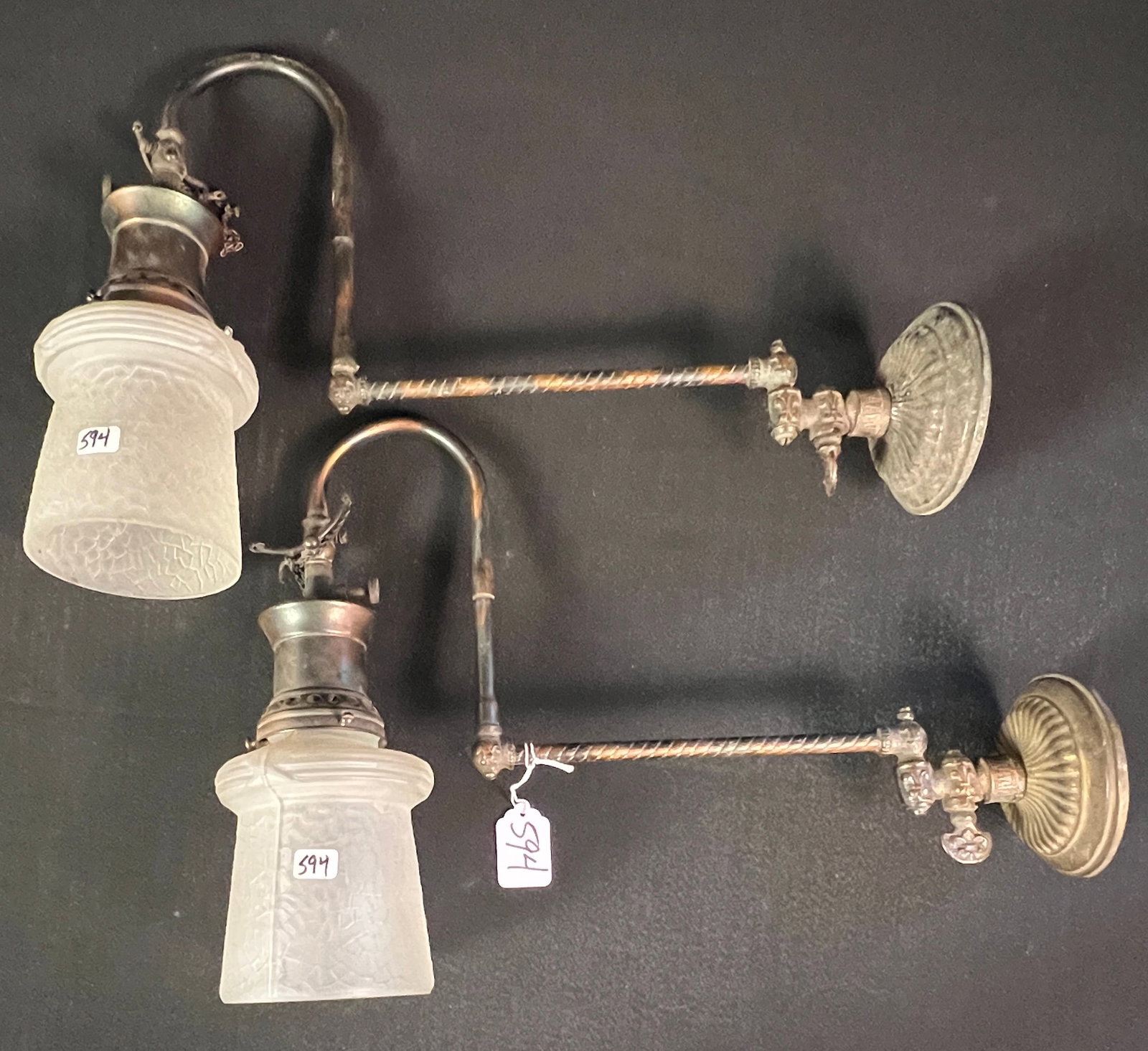 Pair of Victorian Wall Sconces: A pair of Victorian copper gas wall sconces with fancy shades. In good condition, they measure 17" long.
