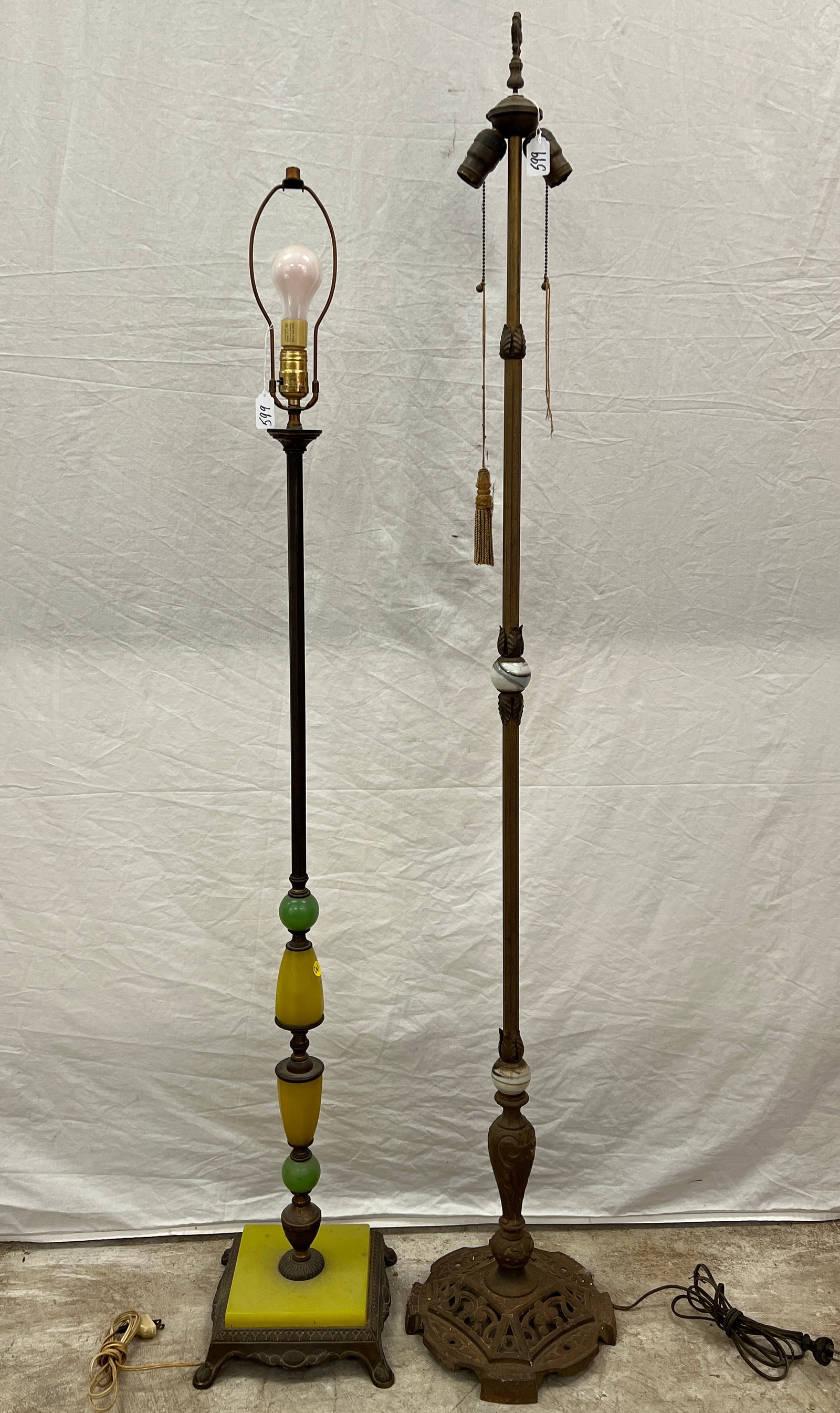 Two 1920s Floor Lamps: Two 1920s floor lamps with slag glass inserts. In need of restoration and both measure 48" tall.