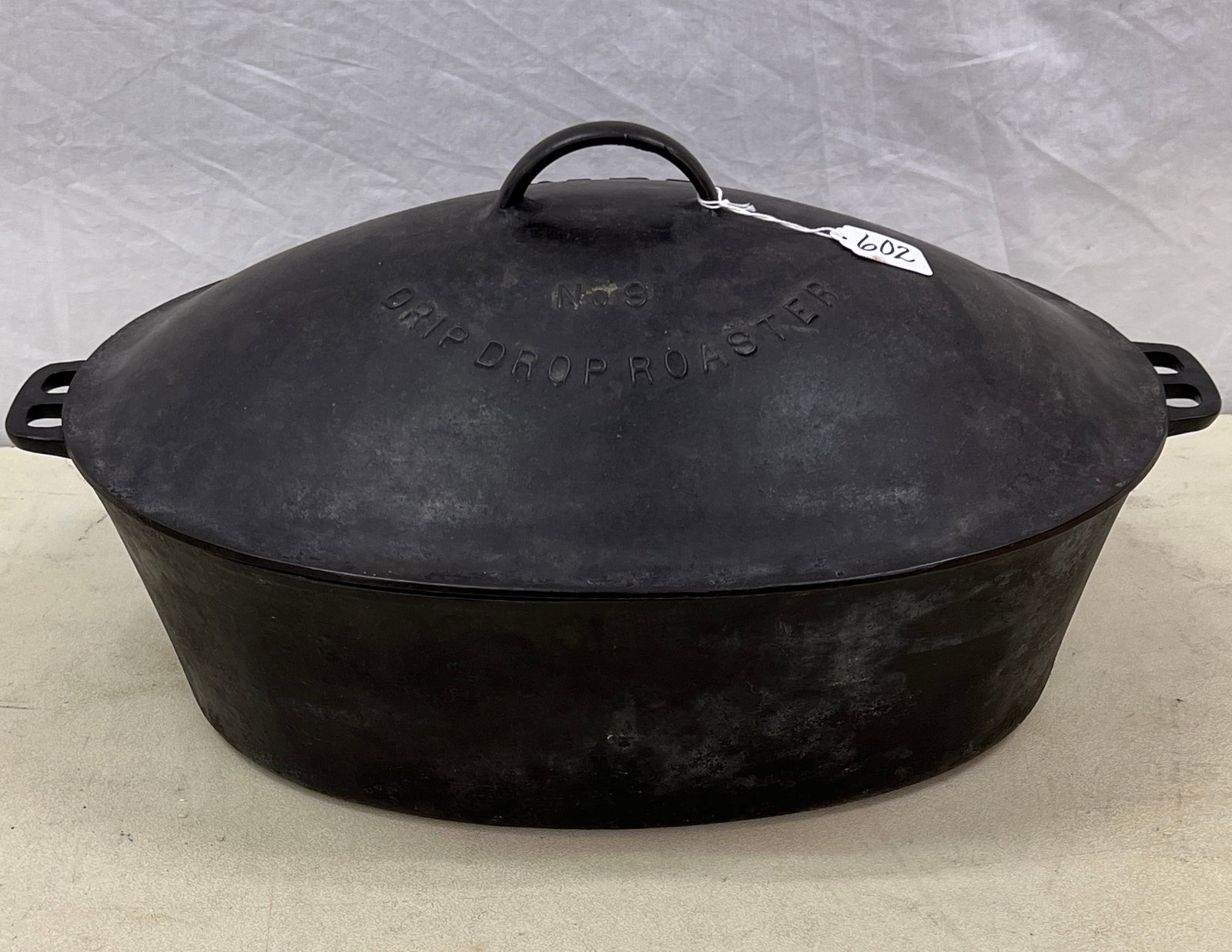 Rare Wagner No. 9 Roasting Pot: A rare cast iron Wagner ware drip drop roaster no.9 with cover, handles and inserts. In excellent condition, it measures 20.5" long X 13.5" across and 10" tall with cover. In excellent, house ready