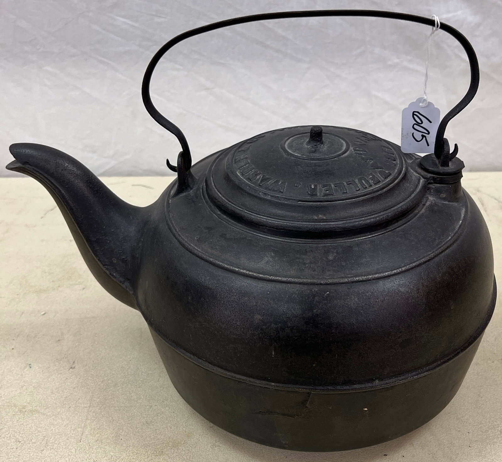 1861 Large Cast Iron Kettle: A vintage Fuller, Warren & Co. large cast iron kettle from Troy, NY, c.1861. In good condition, it measures 8" tall X 15" across X 10" round.