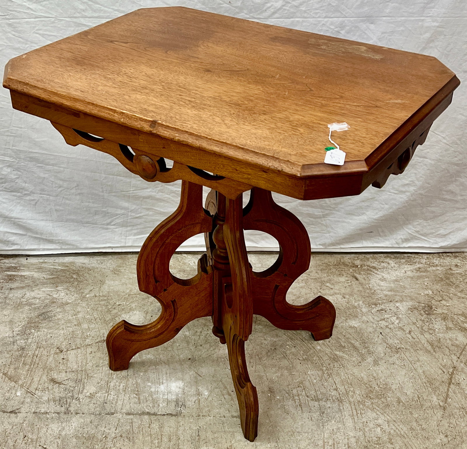 Walnut Victorian Parlor Table: A walnut Victorian parlor table with a serpentine base in refinished condition. It is house ready and measures 28" tall X 29" across X 21" deep.