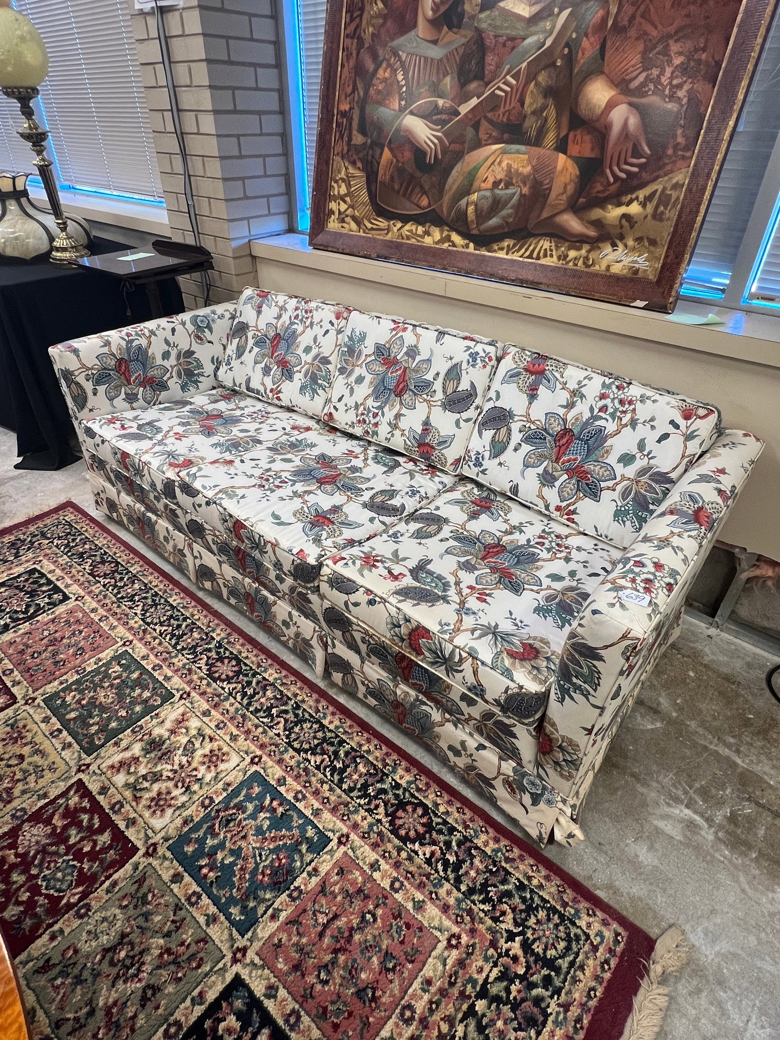 Thomasville Floral Sofa: A Thomasville sofa in an elaborate floral pattern. In excellent condition, it measures 28" tall X 78" across X 24" deep.