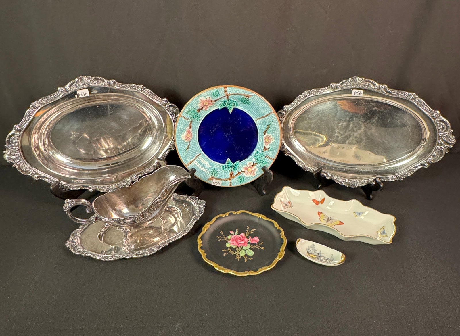 Quality Porcelain and Silver Plate: A quality porcelain and silver plate to include a 8.5" floral majolica plate, a 6" Rosenthal rose plate with gold edge, a 9" long Limoges butterfly pin tray, a Limoges salt cellar with scene of surrey
