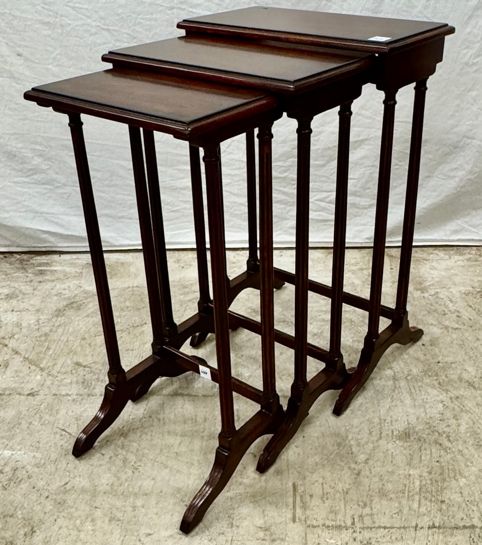 McNabb and Risley Mahogany Netsing Tables: A group of 3 contemporary McNabb and Risley mahogany nesting tables in very good condition. Table remeasures 30" tall X 41" across X 34" wide. Chairs measure 33" tall X 17.5" across X 18" deep.
