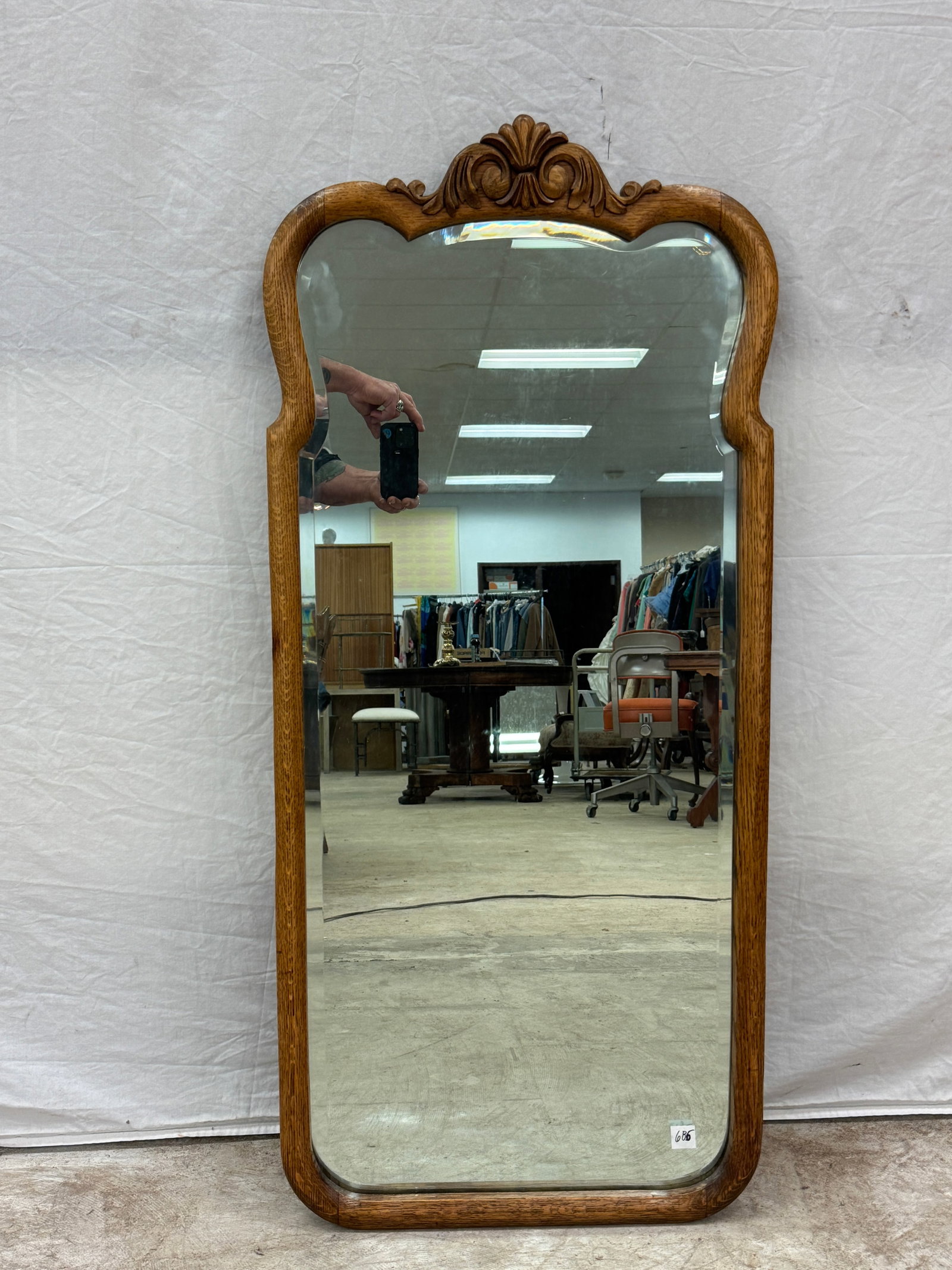 Carved Oak Bevelled Wall Mirror C1880's: An antique oak beveled wall mirror c.1880's that features a serpentine frame with a carved crown in excellent condition.