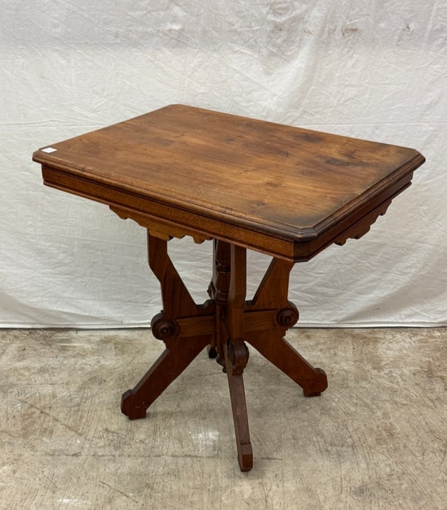 Victorian Walnut Parlour Table c.1890's: A Walnut Victorian parlor table with carved base and legs in good condition. It measures 29.5" tall X 30" across X 22" deep.
