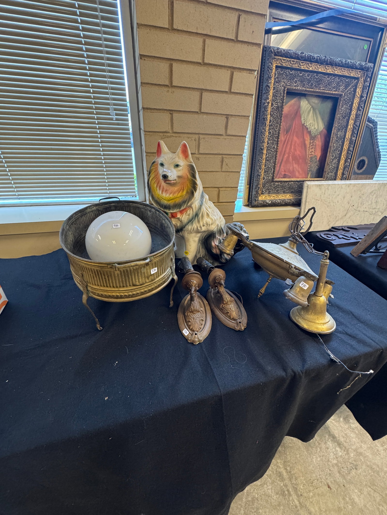 Group to Include Wall Sconces, Chalkware Dog, and More: A group to include brass fancy wall sconces, a footed double handled planter, a globe, a chalkware dog, and a pan fixture. All in as found condition.