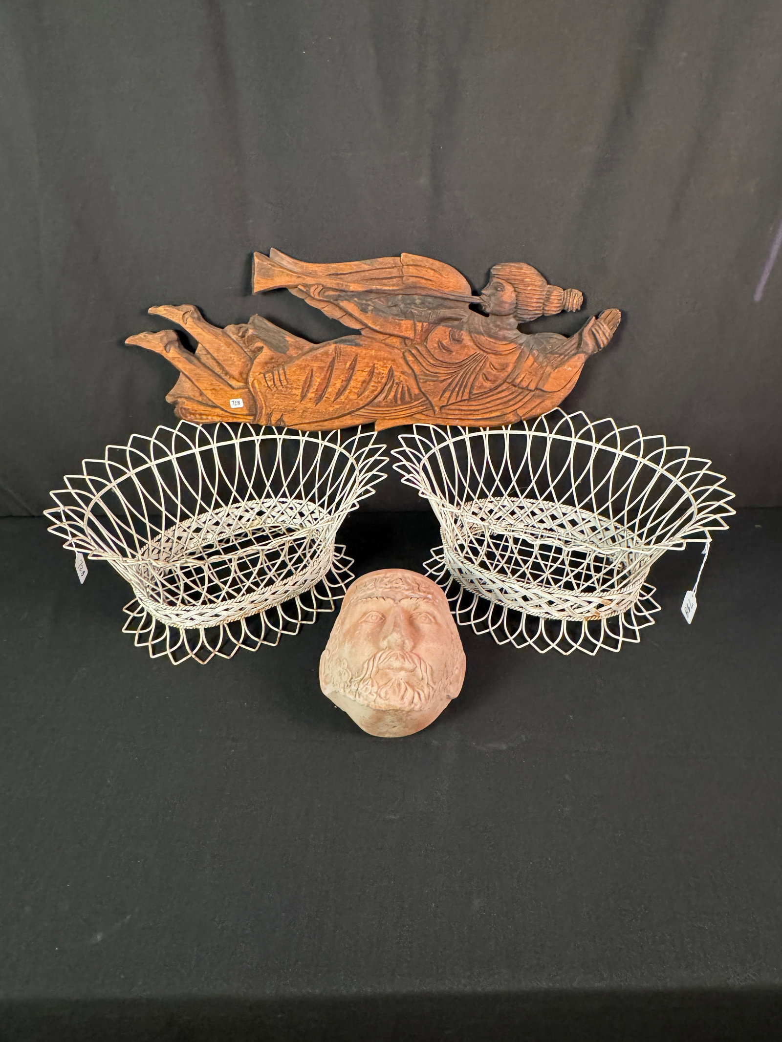Hand Carved wood Angel, Planters!: A vintage wall hung hand carved angel playing a horn ( 10" tall X 28.5" across), 2 white oval wire planters (9" tall x 18" across), and acerra cotta wall pocket in the shape of a man's face (8" tall X