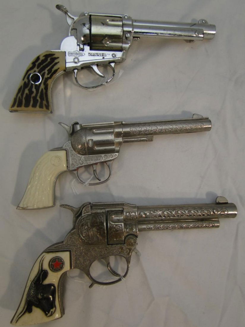 3 toy cap pistols to include "Rodeo Hubley", "Shootin': 3 toy cap pistols to include "Rodeo Hubley", "Shootin' Shell Fanner" by Mattel, and "Texan JR"