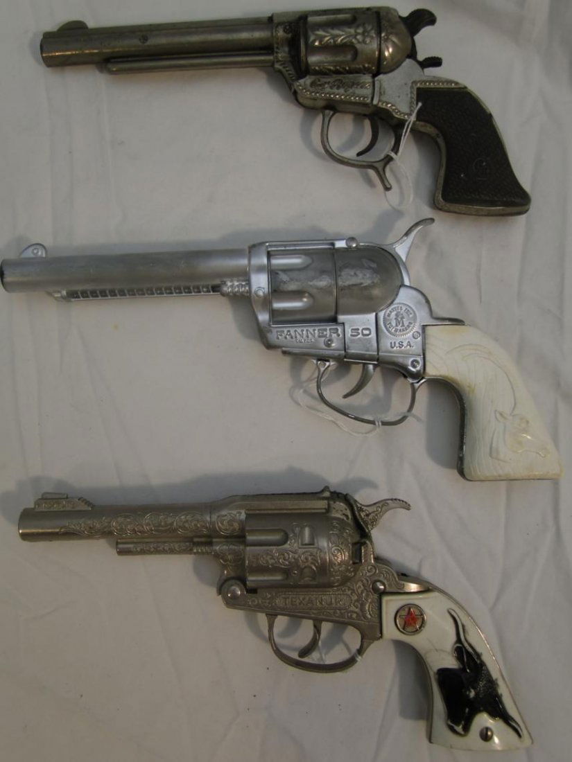 3 toy cap pistols to include "Fanner 50" by Mattel,: 3 toy cap pistols to include "Fanner 50" by Mattel, "Texan Jr Hubley", and "Roy Rogers"