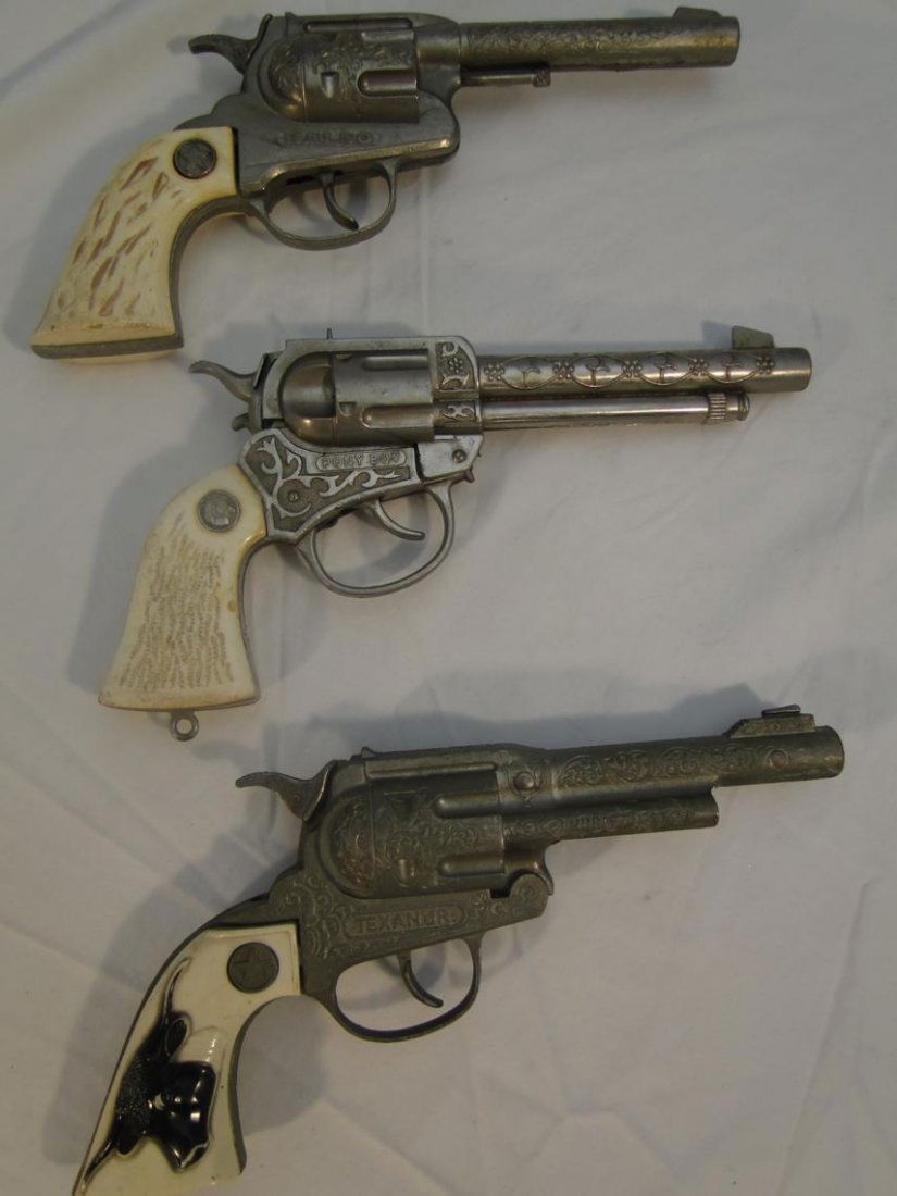 3 toy cap pistols to include "Ranger Halco", "Texan Jr: 3 toy cap pistols to include "Ranger Halco", "Texan Jr Hubley", and "Pony Boy"