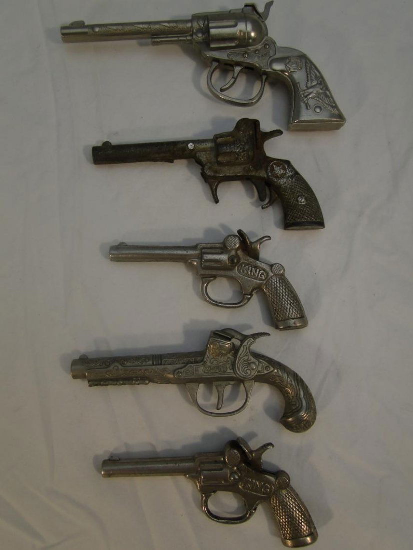 5 toy cap pistols to include 2 "King"s, "Caddy",: 5 toy cap pistols to include 2 "King"s, "Caddy", "Midget Flintlock" by Hubley and "Pony"