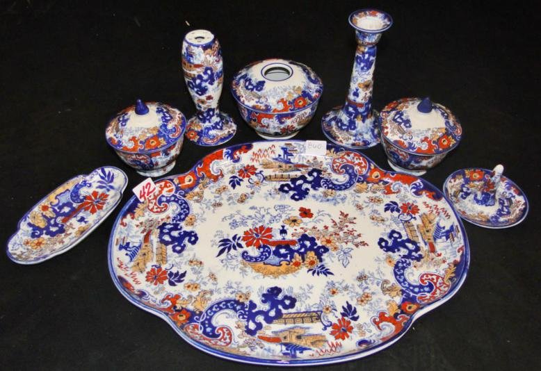 A rare and complete Corey Hill Flow Blue and: A rare and complete Corey Hill Flow Blue and Chinoiserie dresser set consisting of undertray, hair reciever, hat pin holder, ring holder, pin dish, and two covered powder dishes in good condition