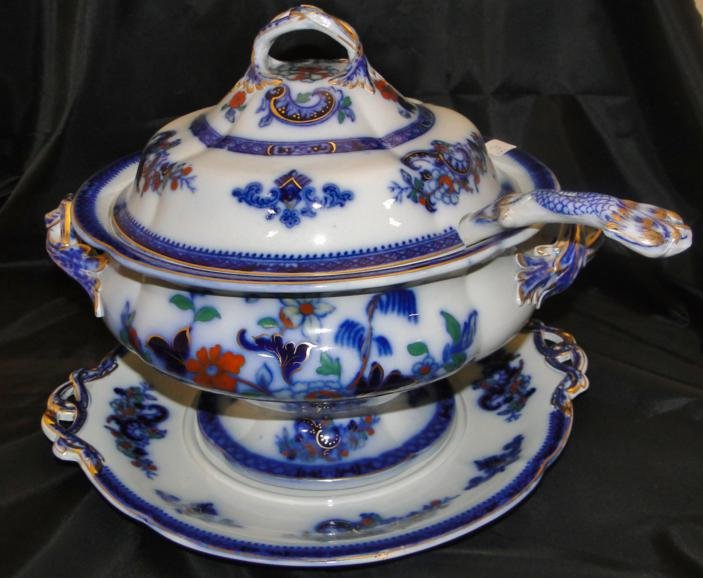 A rare Ridgeway Flow Blue Hong Kong pattern covered: A rare Ridgeway Flow Blue Hong Kong pattern covered tureen with ladle, moulded handles, and original underplate. Underplate has hairline, everything else is perfect.