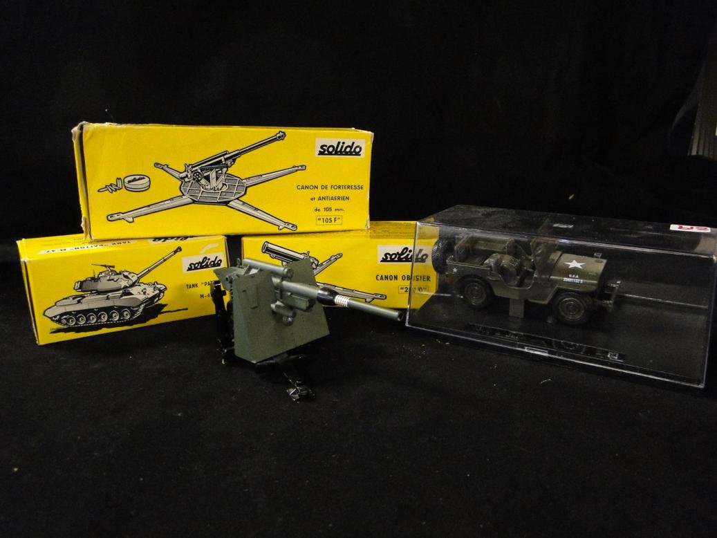 A lot of 5 military style toys to include Solido Canon: A lot of 5 military style toys to include Solido Canon Obusier "250/0" in original packaging, a Solido Canon De Forteresse "105 F", a Solido Tank "Patton" M-47, a U.S. military jeep in a case and a Di