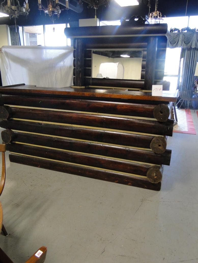 Wonderful folk art log cabin style front and back bar: Wonderful folk art log cabin style front and back bar built in the 1920s. This folk art back bar retains its original copper sink and tapper, and the back bar has a double door over drawers storage co