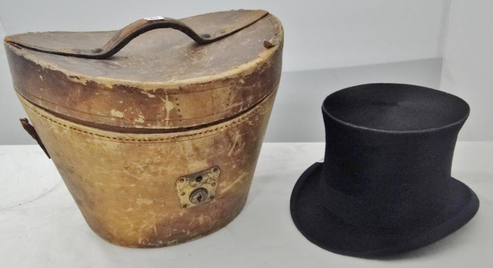 A leather top hat carrying case along with two beaver: A leather top hat carrying case along with two beaver trimmed top hats