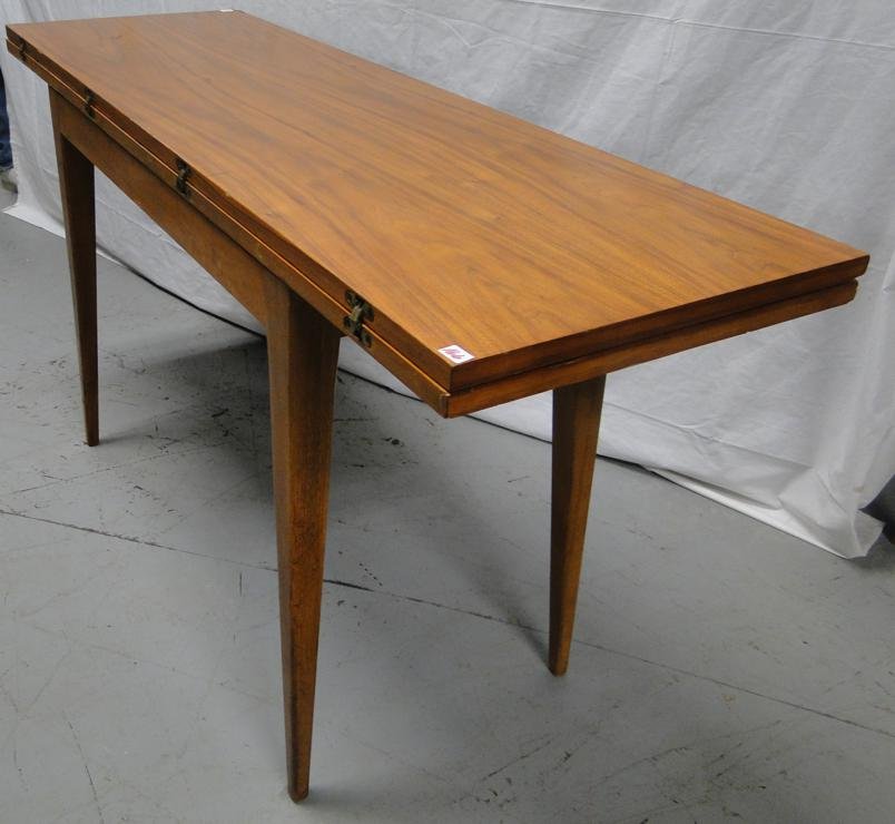 Dunbar Mahogany flip top pencil legged side or dining: Dunbar Mahogany flip top pencil legged side or dining table. Signed Dunbar. Table measures 29" tall. Closed it measures 17" wide, open it measures 34" wide. It is 54" long.