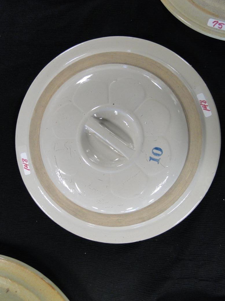 A Red Wing 10 gallon crock cover with molded petal lid.: A Red Wing 10 gallon crock cover with molded petal lid. It measures 16" across