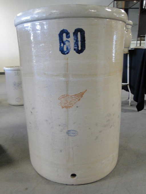 a rare signed red wing 60 gallon crock with spout hole