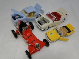 A group of 4 die-cast cars to include a Nylint Thimble: A group of 4 die-cast cars to include a Nylint Thimble Drome race car by Champion along with 1965 Mustang by Mira, another by the same company and a miniature mustang. The race car is 9" long.