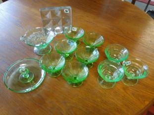 A Blenko glass book end and 9 Depression parfait: A Blenko glass book end and 9 Depression parfait glasses along with a Depression glass candy dish.