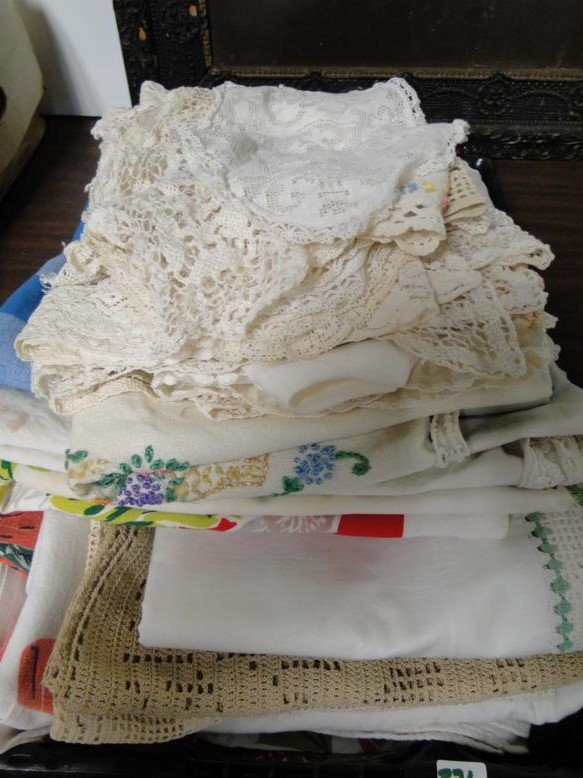 An immense lot of 1950's table cloths, doilies, pillow: An immense lot of 1950's table cloths, doilies, pillow cases and more.