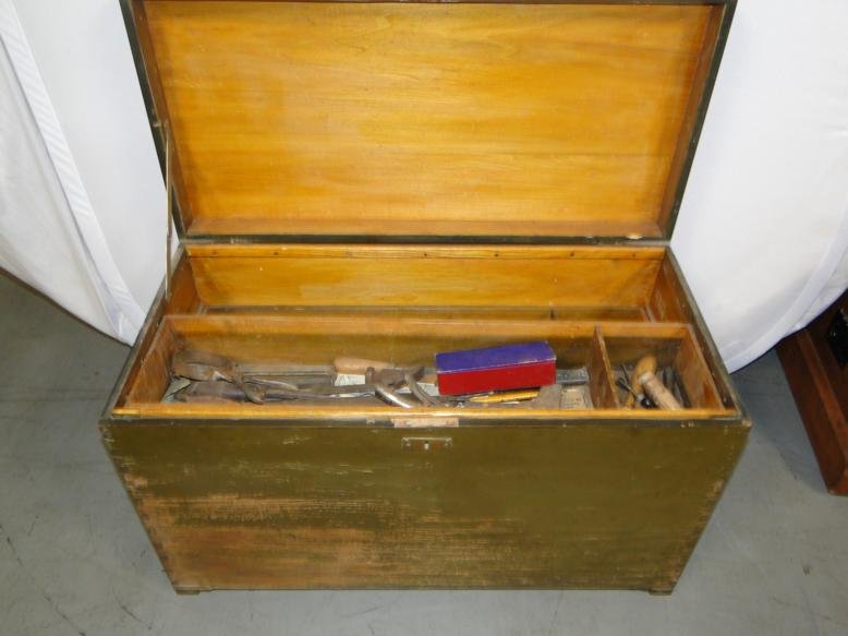A dovetailed carpenter's box with adjustable wood: A dovetailed carpenter's box with adjustable wood shelved filled with miscellaneous tools in original green paint.