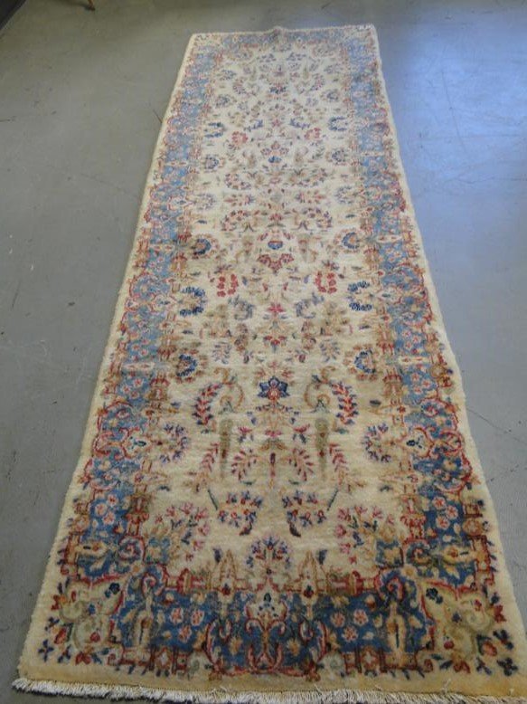 A hand-tied floral oriental runner in creams, blues and: A hand-tied floral oriental runner in creams, blues and pink, 97" x 30"