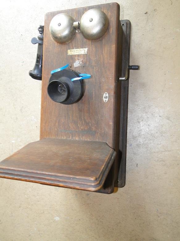 An oak wall mount telephone which retains its original (1 of 3)