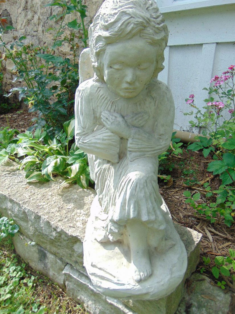 Contemporary winged child angel. Concrete garden (1 of 3)
