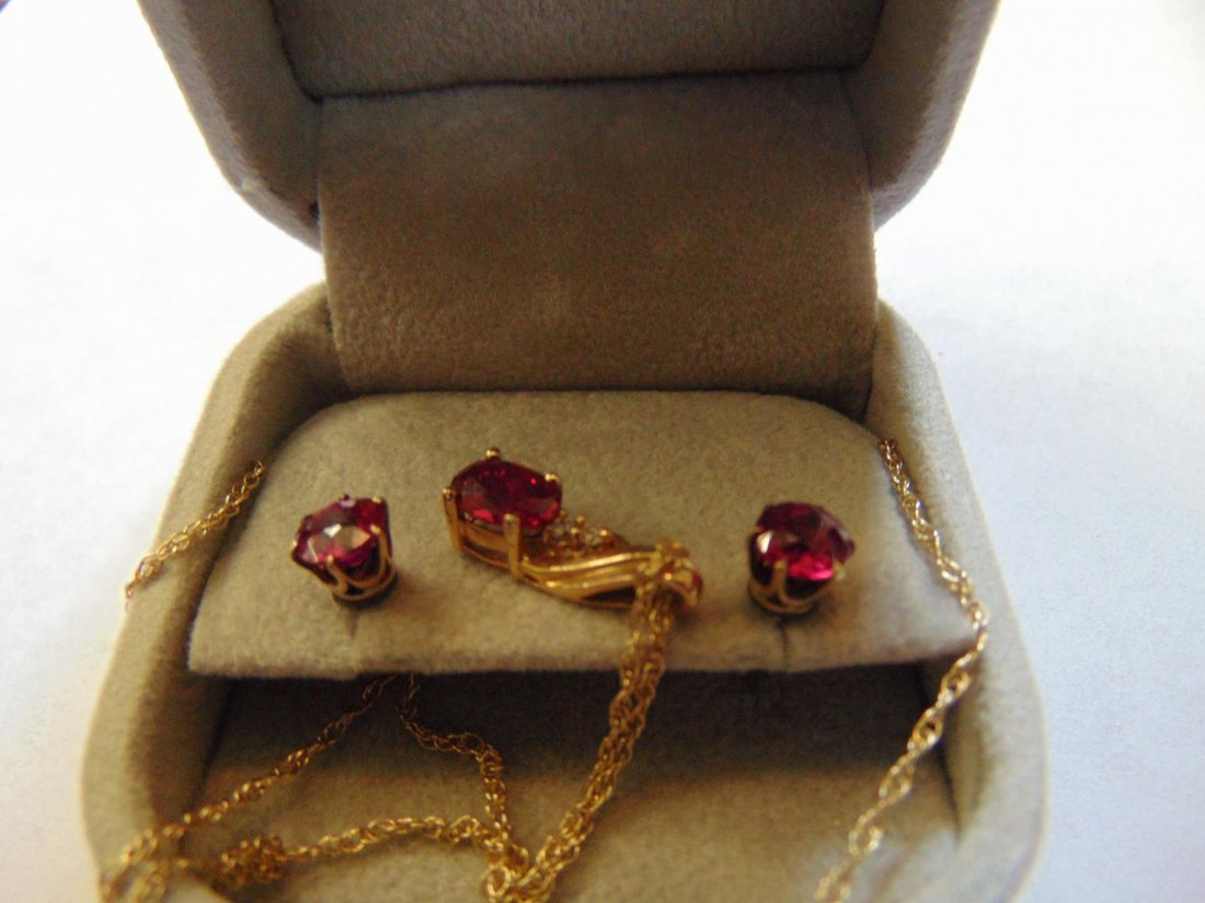 Set of 14k gold and ruby pierced earrings along with (1 of 2)