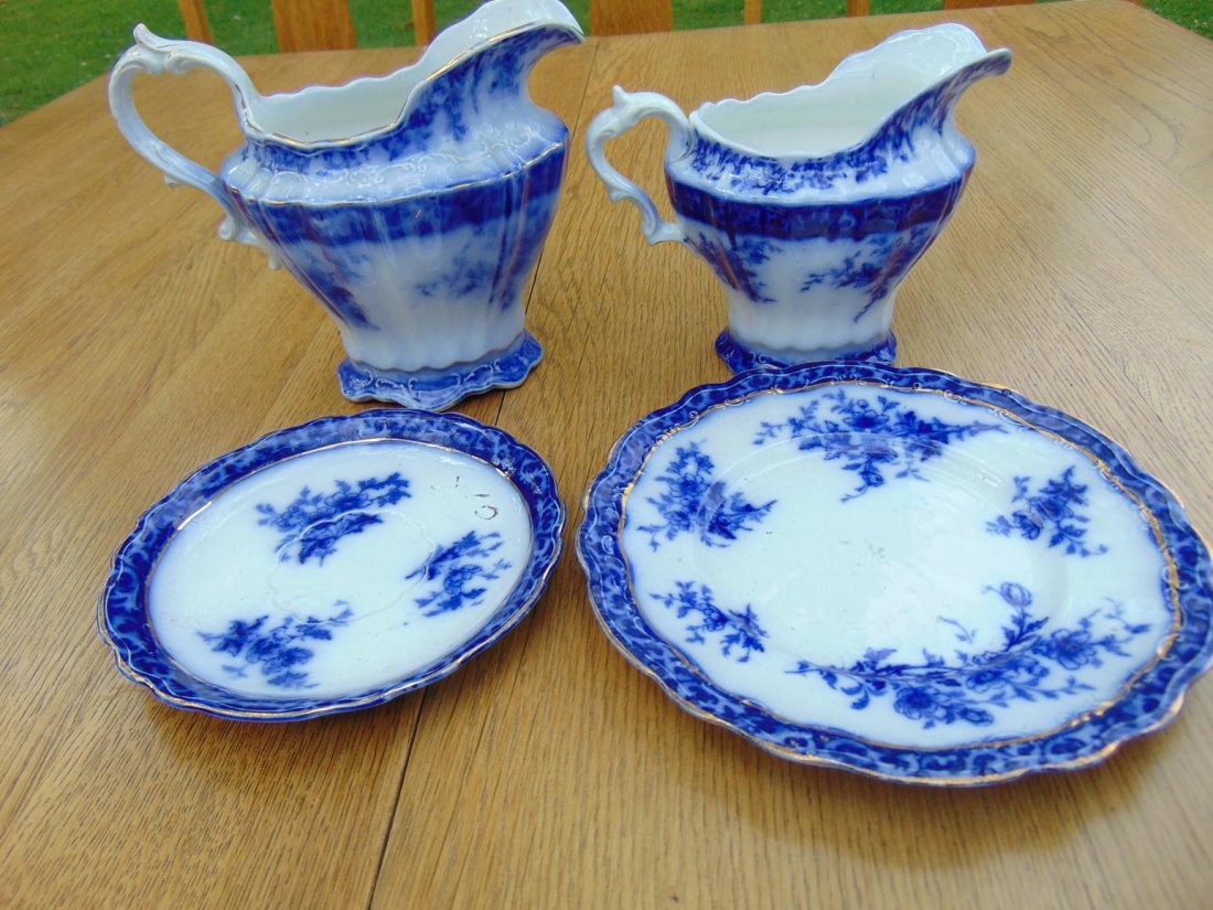 Four pieces of flow blue to include two cream pitchers (1 of 2)