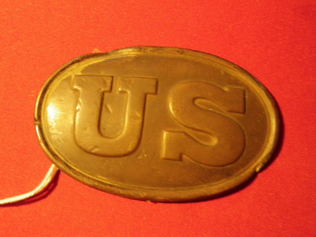 Cartridge Box Plate: US Regulation 1839 Oval Pattern, Approx. 56x87mm, No Maker Marking, Some Dented Areas on Brass, Lead Filled, Loops Rusted Away, "Battle of Lookout Mountain Tenn" written on back.