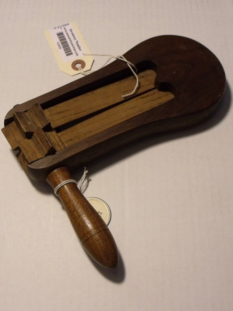 Naval Alarm Rattle: Wooden Alarm Rattle, US Navy, Stamped USN 1858, No visible maker's information, 8 1/2" long, Wood & metal construction, One broken sprocket tooth
