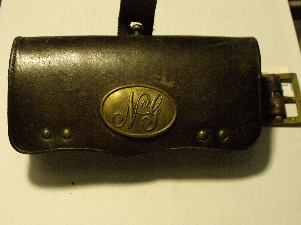 Cartridge Box, US: Frazier's Patent 1872-1878 Cartridge Box, Maker's information stamped inside leather Ridabock & Co & McKenney New York stamps inside, Brown Leather in fine condition, Brass NG oval plate on front flap