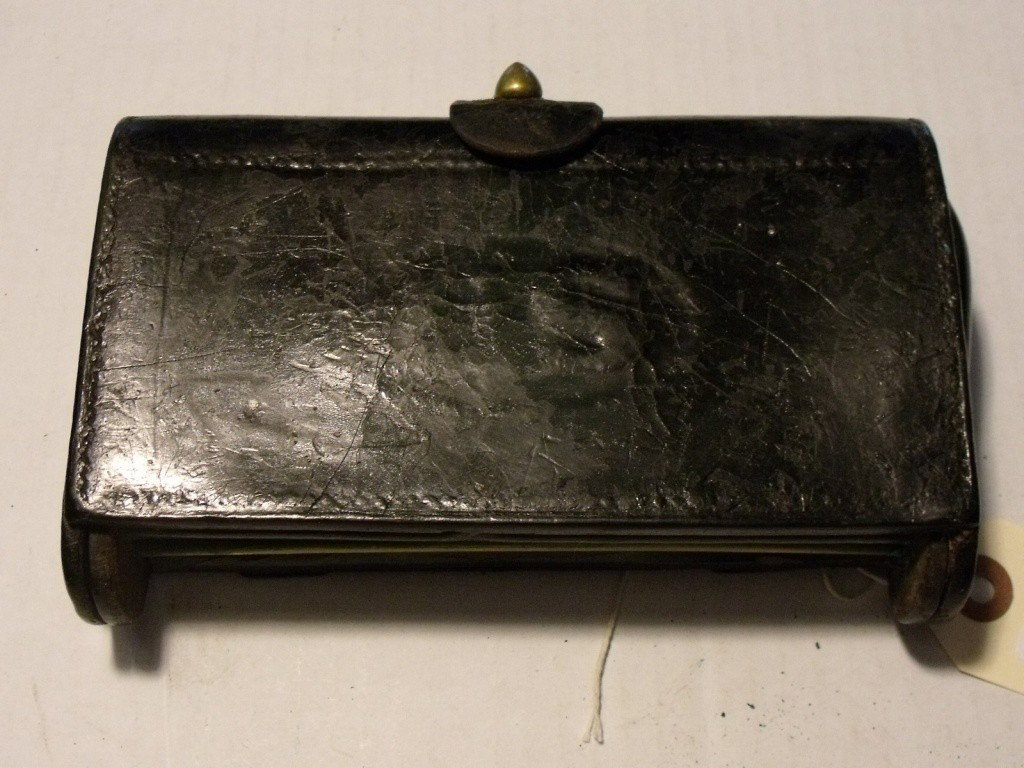Cartridge Box, US: US Model 1874 McKeever Cartridge Box, Black Leather, No brass escutcheon plate, No arsenal markings visible, Approx. 6.5" wide, Inside webbing is torn in areas of loops, Leather in good condition, No 