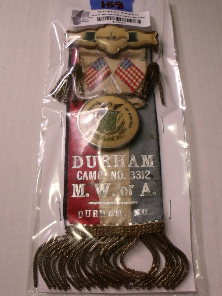 Modern Woodmen of America Ribbon: Modern Woodmen of America ribbon with celluloid pin. Durham Camp No. 3312 M.W.of A. Durham Mo. This is a pretty elaborate fancy ribbon.