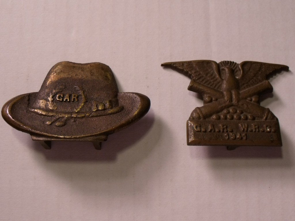 G.A.R. Desk Display: Two brass desk display items. One is a hat marked G.A.R. the other is an eagle with crossed canons marked G.A.R. W.R.C. 1941. I think that the hat is holder.