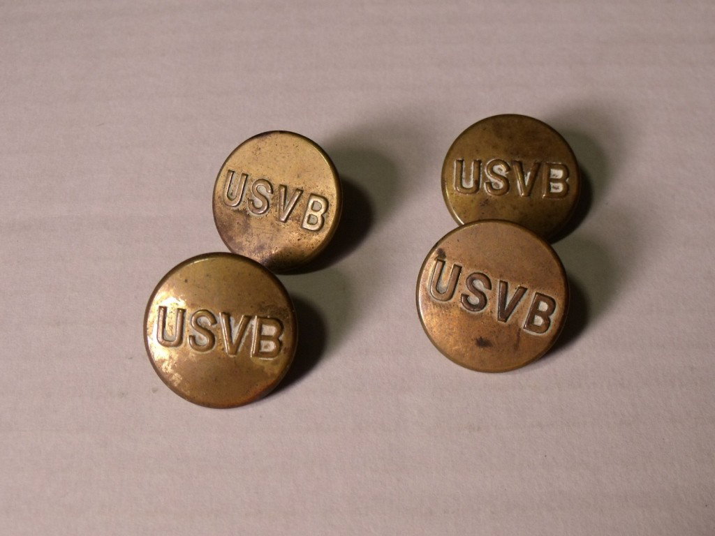 Four Antique Buttons: Possibly United States volunteer brigade buttons. The buttons are marked USVB.