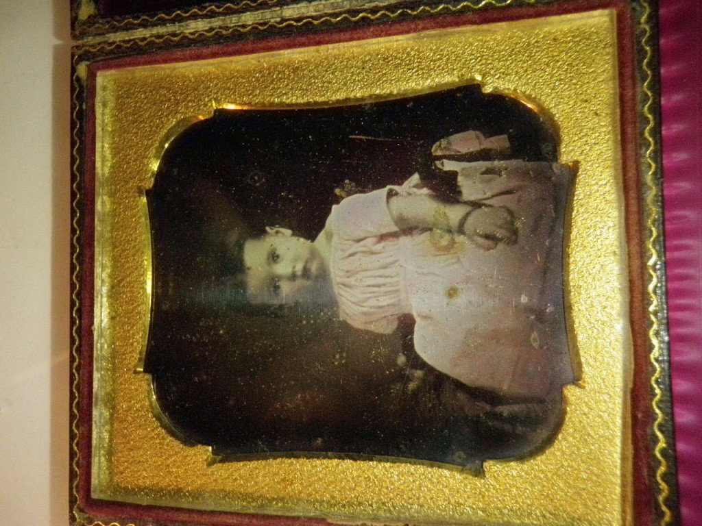 Daguerreotype: Shows young female child. Comes in a red velvet lined frame.